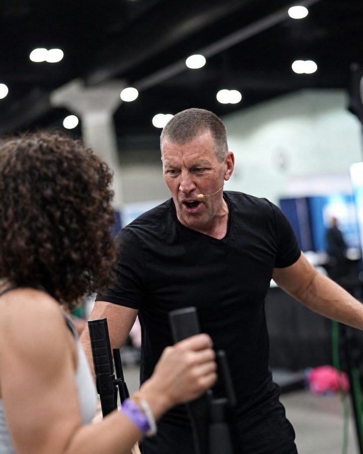 Dan Metcalfe coaching a participant through a movement drill